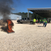 Group of volunteers practicing fire extinguishing 