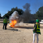 Two volunteers practicing fire extinguishing