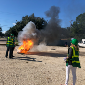 Two volunteers practicing fire extinguishing 